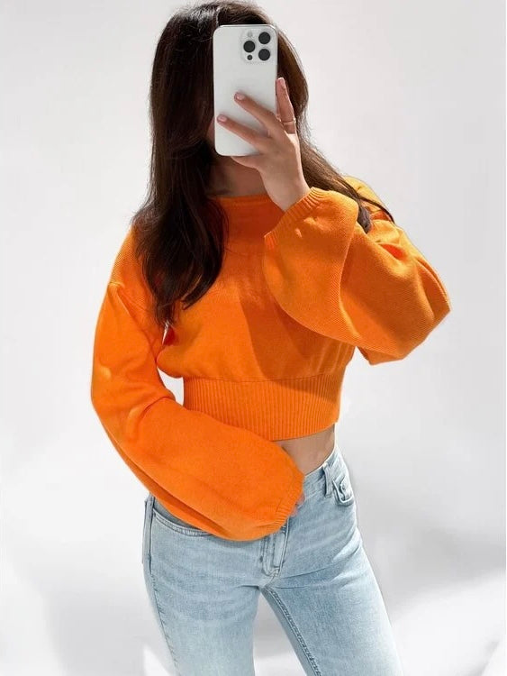 Oranje trui met uitlopende mouw