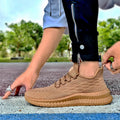 Dames performance vrijetijdssneakers met gebreid bovenwerk – Bruin
